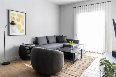 a living room with a couch and a chair at Elliot Petralona, Athens in Athens