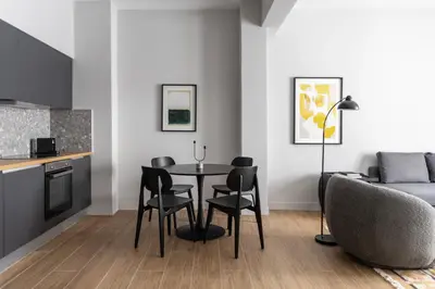 a kitchen and dining room with a table and chairs at Elliot Petralona, Athens in Athens