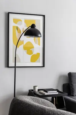 a living room with a black floor lamp and a chair at Elliot Petralona, Athens in Athens