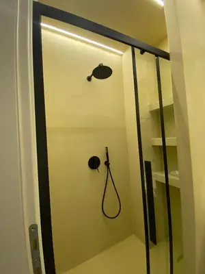 a shower stall with a shower head and a shower at Stairway to Lycabettus in Athens