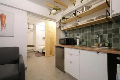 a kitchen with a sink and a counter top at The Extravagant studio in Pagkrati, Near Stadium in Athens