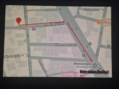 a map of a city with a red line at Apartment Ioanneta - Vintage decorated, city center, close to metro station in Athens