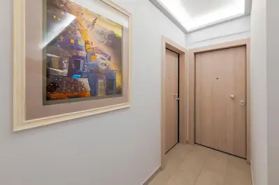 a painting hanging on a wall in a hallway at Athens Central-Opulent and Luxurious Suites-Balcony & Views Acropolis Hills in Athens