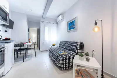 a living room with a couch and a table at Athens Central-Opulent and Luxurious Suites-Balcony & Views Acropolis Hills in Athens