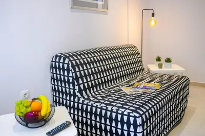 a living room with a couch and a bowl of fruit at Athens Central-Opulent and Luxurious Suites-Balcony & Views Acropolis Hills in Athens
