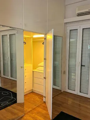 a room with a closet with a mirror at Acropolis Elegant Apartment II in Athens