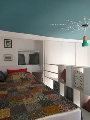 a bedroom with a bed and a blue ceiling at Σπίτι - Κάστρο πάνω από τη θάλασσα in Piraeus