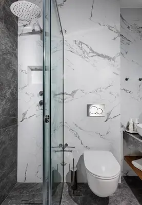 a bathroom with a toilet and a glass shower at Florant in Athens