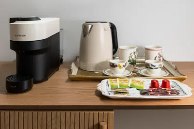 a plate of food on a counter next to a coffee maker at Florant in Athens