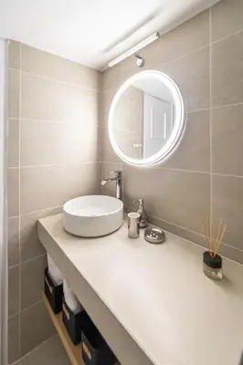 a bathroom with a sink and a mirror at Home1 in Athens