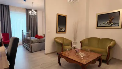 a living room with two chairs and a table at Athens Point Hotel Monastiraki in Athens
