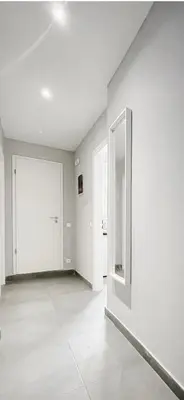 an empty room with a white wall and a door at Calliope Suite 4 with Acropolis rooftop access in Athens