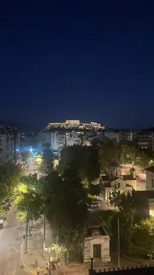 a view of a city at night at Calliope Suite 4 with Acropolis rooftop access in Athens