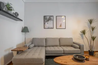 a living room with a couch and a table at Maison Terrasse - Georgeous 3Br Apt next to Acropolis in Athens
