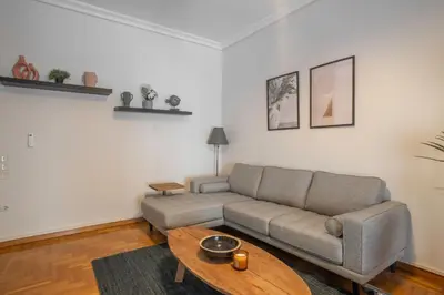 a living room with a couch and a table at Maison Terrasse - Georgeous 3Br Apt next to Acropolis in Athens