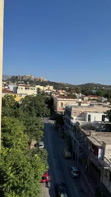 a view of a city with cars parked on a street at The Green Parthenon in Athens
