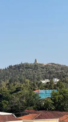 a view of a hill with a swimming pool at The Green Parthenon in Athens