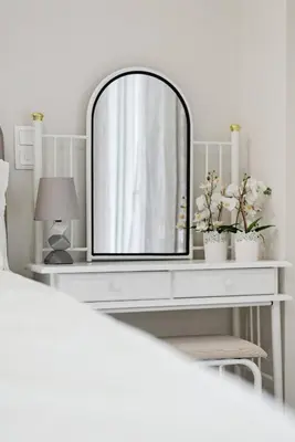 a white dressing table with a mirror on it at Athene Appartment in Athens