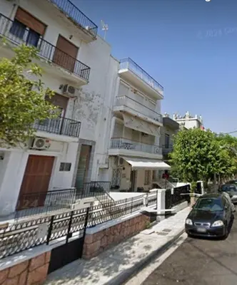 a car parked in front of a building at Seaside Resort in Piraeus