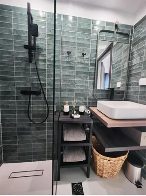 a bathroom with a shower and a sink and a mirror at Glyfada Center Front Seaview Studio A in Athens
