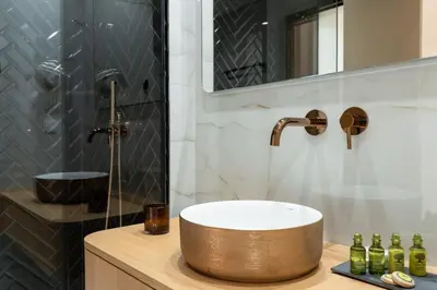 a bathroom with a sink and a shower at Acropolis View By Ermou in Athens