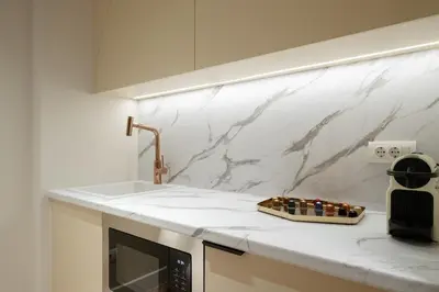 a kitchen counter with a sink and a microwave at Acropolis View By Ermou in Athens