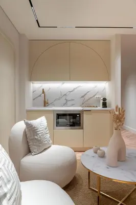 a living room with a chair and a table at Acropolis View By Ermou in Athens