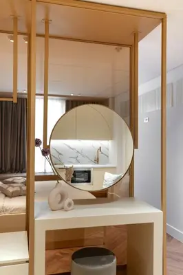 a mirror on a table in a bedroom at Acropolis View By Ermou in Athens
