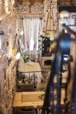 a room with a bed and a table in a room at Olvion House in Athens