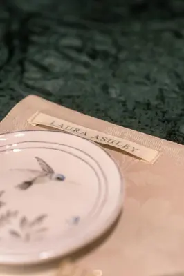 a white plate sitting on a table with a napkin at Athens Marbles-Classic suite in Athens