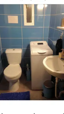 a bathroom with a toilet and a sink at BUDGET FLAT , 10 min from Victoria square in Athens