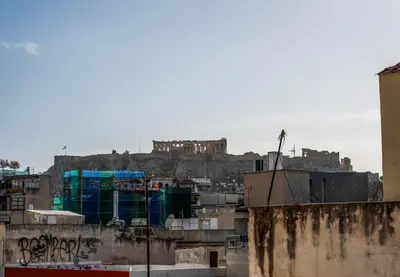 a view of a city with a castle in the background at Athena's Forge in Athens