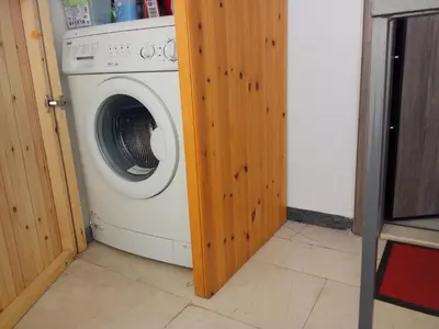 a washer and dryer sitting in a room at Rooftop cozy loft in Athens