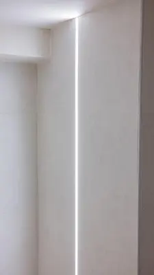 a room with a white wall and a mirror at Central Luxurious Athens Suites- walk to Acropolis - by Good Life suites in Athens