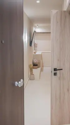 an open door to a room with a hallway at Central Luxurious Athens Suites- walk to Acropolis - by Good Life suites in Athens