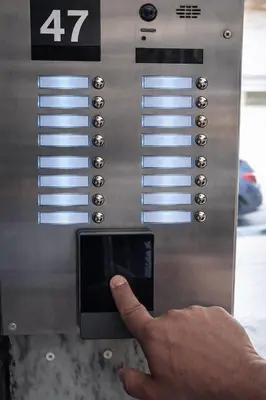 a person holding a cell phone in a machine at Niki Athens Suites - Cosy Suite at Historical Centre Monastiraki in Athens