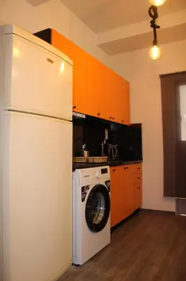 a kitchen with a white refrigerator and a washer at Athens City Themis 1 in Athens