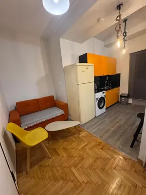 a living room with a couch and a refrigerator at Athens City Themis 1 in Athens