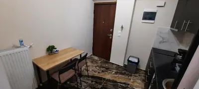 a small room with a wooden table and chairs at NewRoom2AmbelokipiMetroAirportLine in Athens