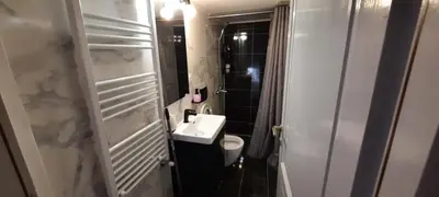 a white bathroom with a sink and a toilet at NewRoom2AmbelokipiMetroAirportLine in Athens