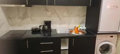 a kitchen counter with a sink and a washing machine at NewRoom2AmbelokipiMetroAirportLine in Athens