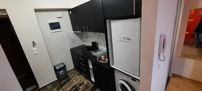 a small bathroom with a sink and a microwave at NewRoom2AmbelokipiMetroAirportLine in Athens