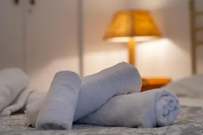 a stuffed animal is laying on a bed at Near Acropolis, Koukaki Retreat in Athens