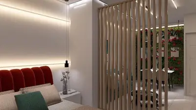 a bedroom with a partition with a bed and a table at Cozy and Modern Flat in Athens