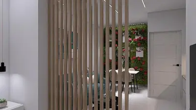 a dining room with a table and chairs and flowers at Cozy and Modern Flat in Athens