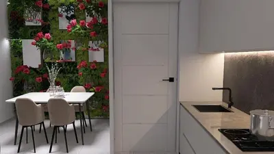 a kitchen with a table with chairs and flowers on a wall at Cozy and Modern Flat in Athens