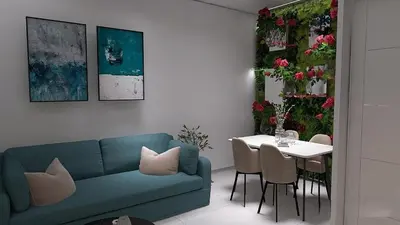 a living room with a blue couch and a table at Cozy and Modern Flat in Athens