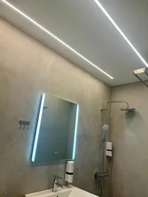 a bathroom with a mirror and a sink at Artemis Patision Suite by Zeus Suites in Athens