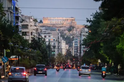a busy city street filled with lots of traffic at Artemis Patision Suite by Zeus Suites in Athens