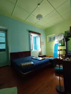 a bedroom with a bed and a window at Sunny apartment next to the Acropolis in Athens